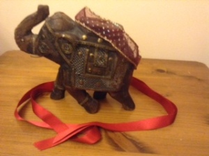 Elephant with red ribbon
